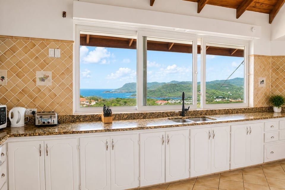 Spacious kitchen with modern appliances and gorgeous views.