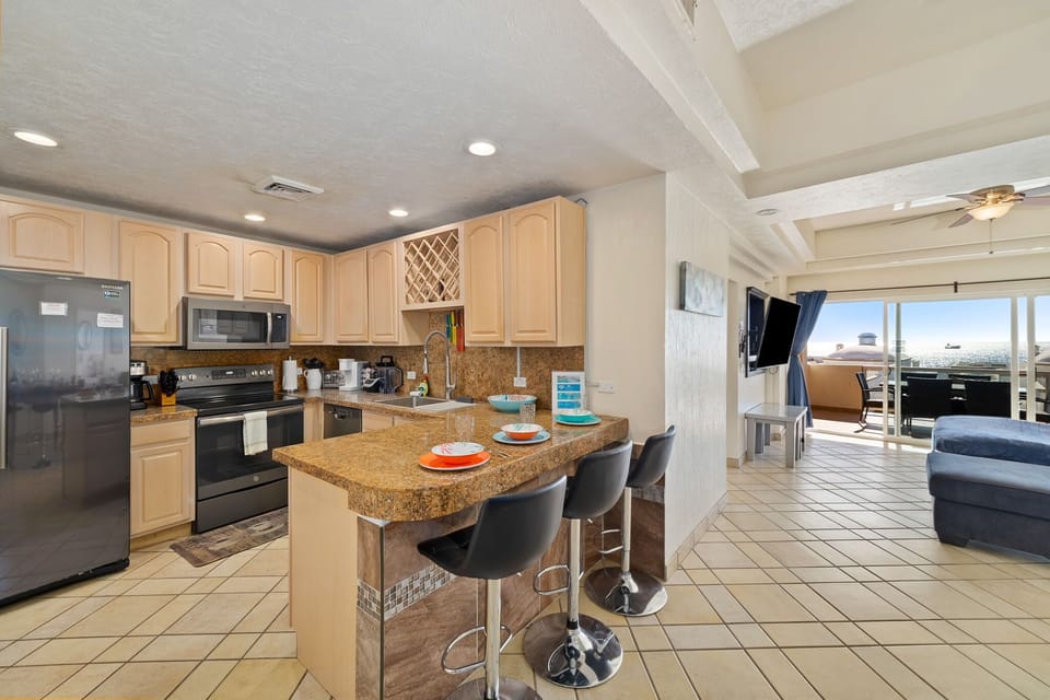 Open concept layout makes it easy to cook, eat, and relax together.