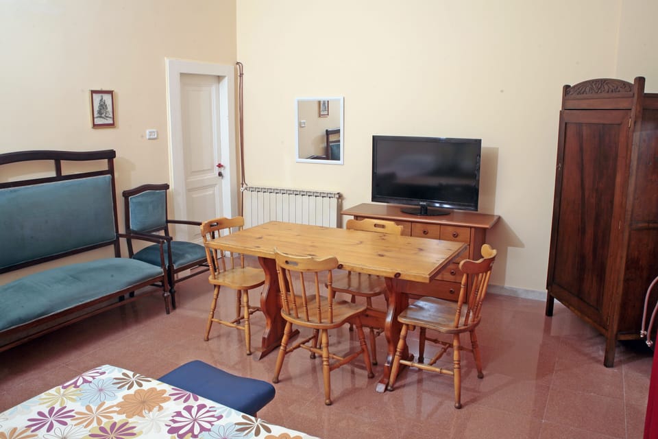 Triple Room, Shared Bathroom | Blackout drapes, iron/ironing board, free WiFi, bed sheets