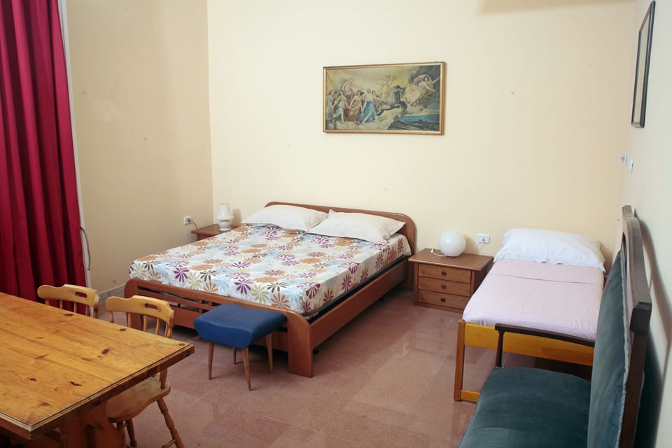 Triple Room, Shared Bathroom | Blackout drapes, iron/ironing board (on request), WiFi (free)