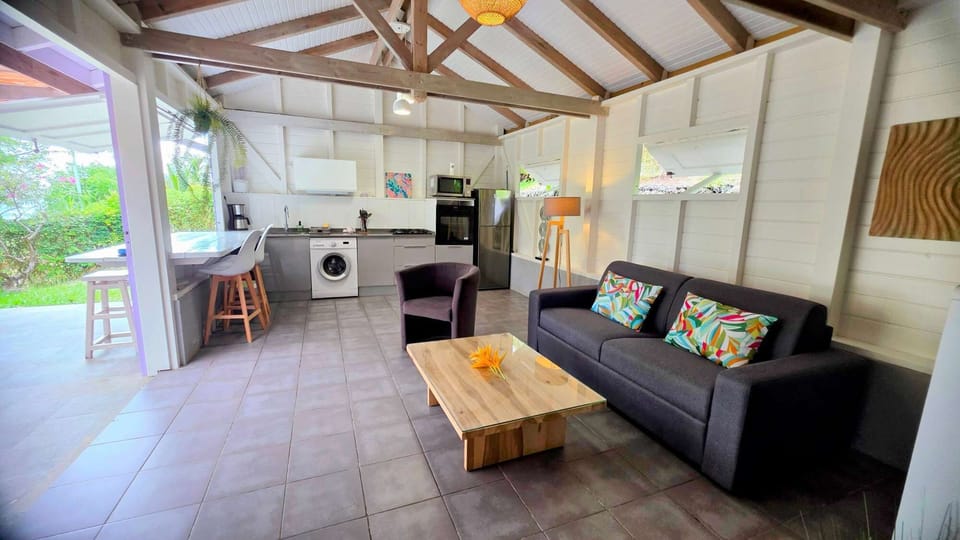 Bright open-plan living space flowing onto the terrace, filled with natural light and tropical breezes