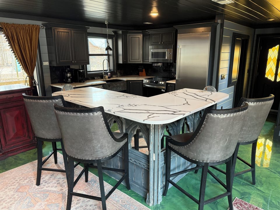 Gather around this stunning quartz island with elegant bar seating, where you'll enjoy morning coffee and evening meals in style.
