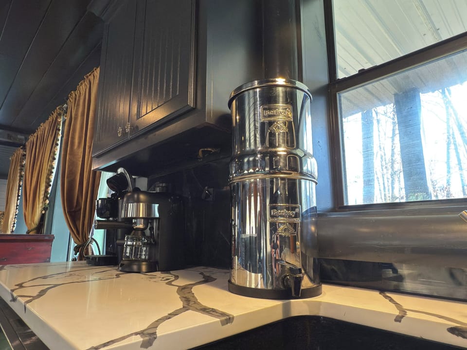 Your mornings start right with Berkey Water Filtration and premium coffee equipment ready for that perfect cup in your fully-equipped kitchen.