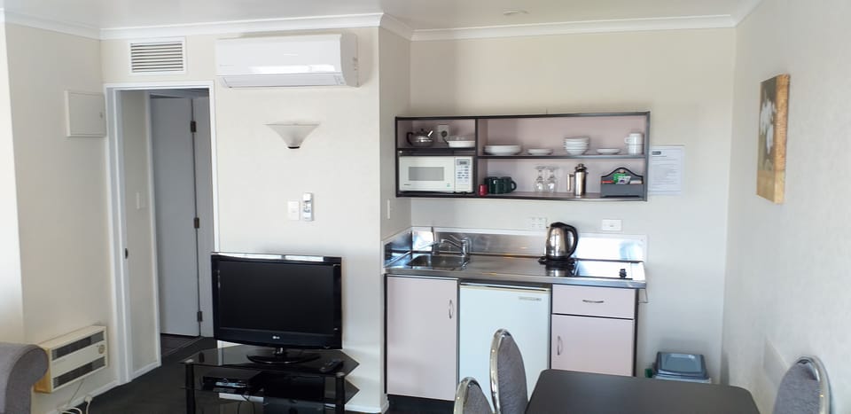 Mini-fridge, microwave, electric kettle, toaster