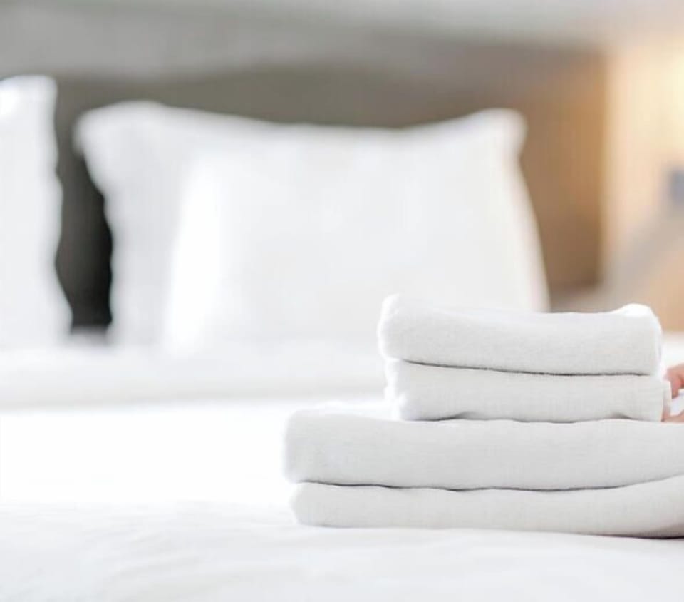 Your room is thoughtfully prepared with fresh linens and plush towels, ensuring you arrive to comfort and convenience so your beach getaway begins the moment you walk in.