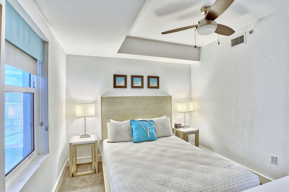 Guest bedroom with a Queen sized bed and flat screen TV