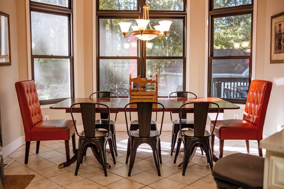 Eat-in kitchen with walkout to hot tub and additional outdoor dining options