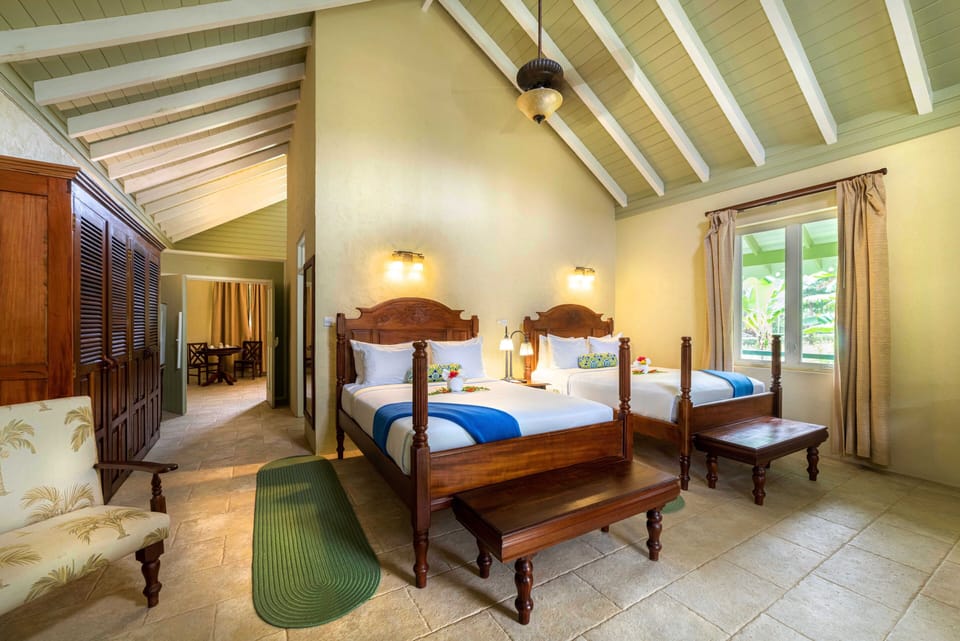 Executive Suite, 2 Queen Beds, River View | Down comforters, in-room safe, individually furnished, desk