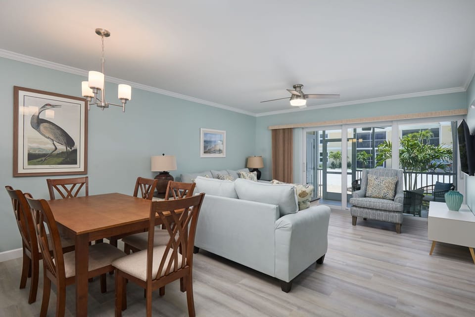 Fully equipped kitchen, expansive living room with comfy furniture, and walk out ground level patio