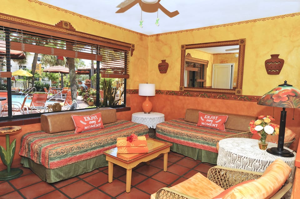 Seaside One Bedroom Suite | Living area | 32-inch flat-screen TV with cable channels, TV