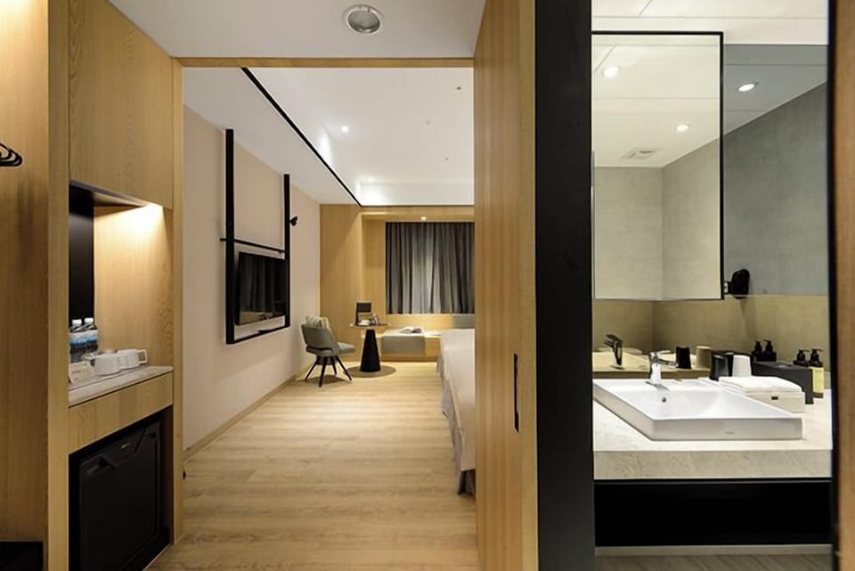 Eco-friendly toiletries, hair dryer, slippers, electronic bidet