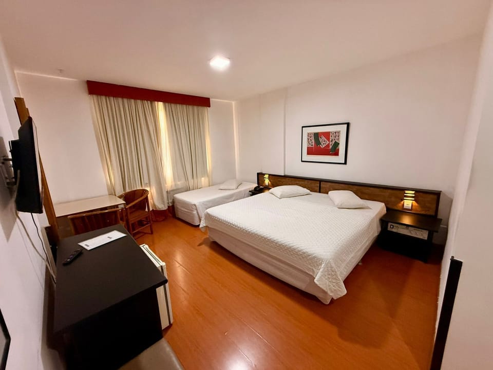 Triple Room | Minibar, in-room safe, desk, laptop workspace