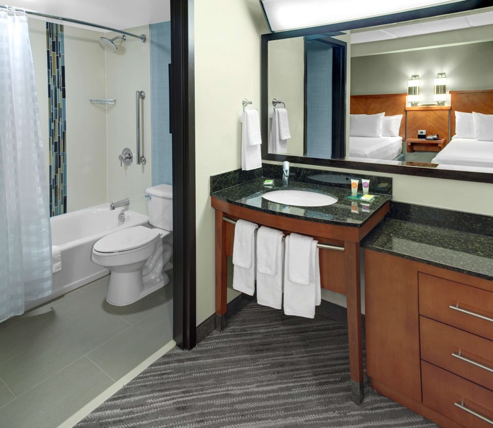 Combined shower/tub, designer toiletries, hair dryer, towels