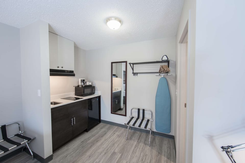 Premium bedding, Select Comfort beds, laptop workspace, blackout drapes