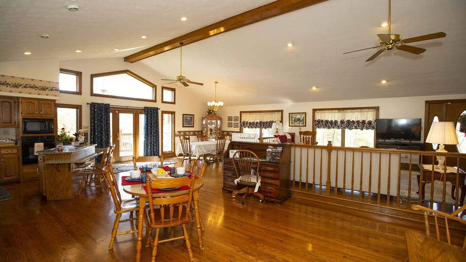 main floor open concept kitchen with dinning area  2 tables ,living room 