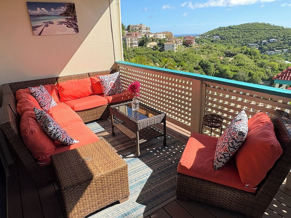 Your comfortable sectional couch is located on your covered balcony