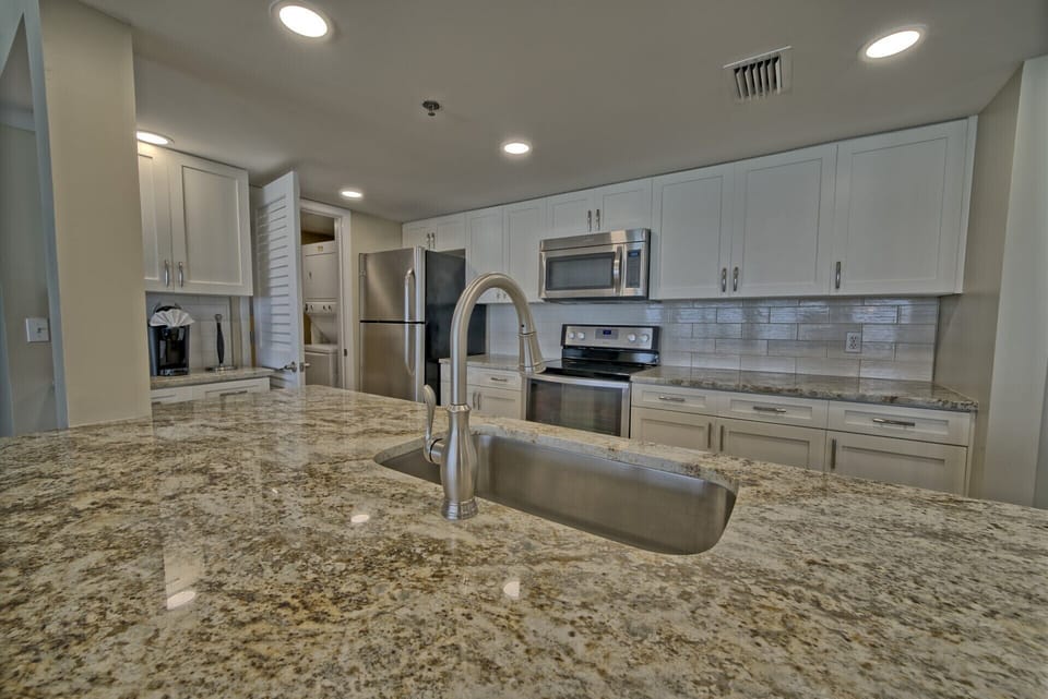 New cabinets, backsplash, cabinets, tile flooring, dishes, cooking utensils