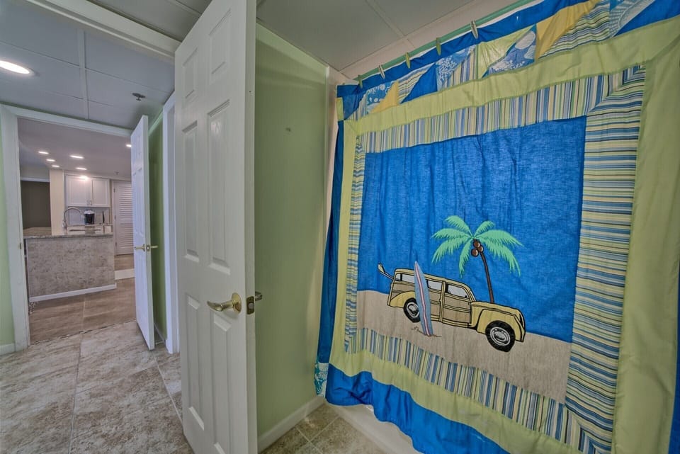 Fun beach themed master bath with oversized step in shower/tub.