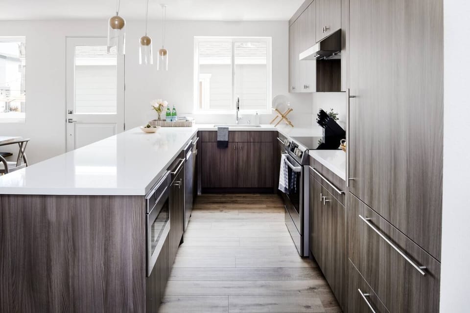 Front door , Microwave, refrigerator, stove, dishwasher, sink, fully stocked kitchen. 