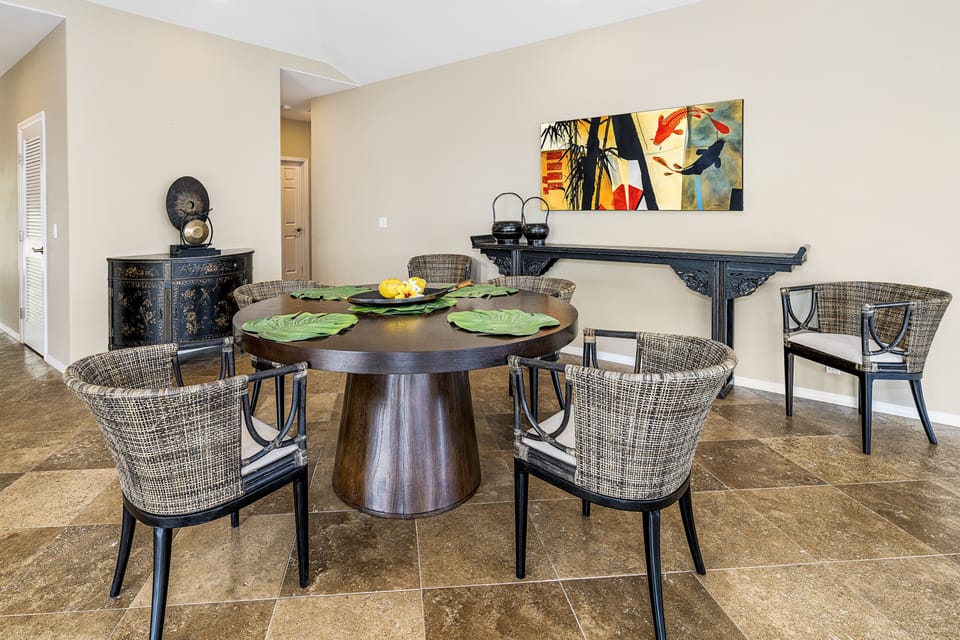 Gather at the round dining table for morning Kona coffee or sunset meals with your loved ones.