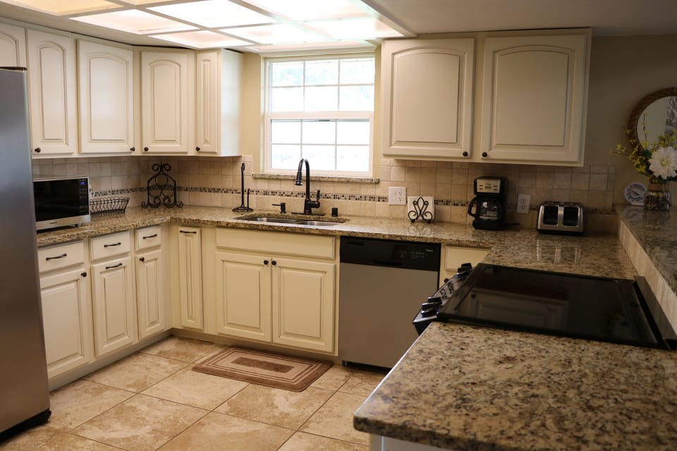 Kitchen with granite counter tops.
