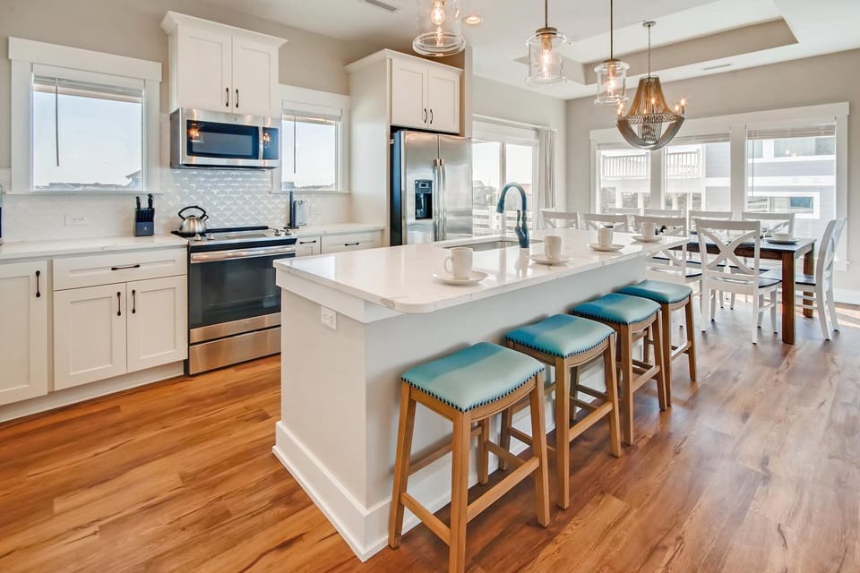 The family chef will appreciate the appointments in the kitchen with spacious design and upscale appliances including two dishwashers for quick clean-ups.