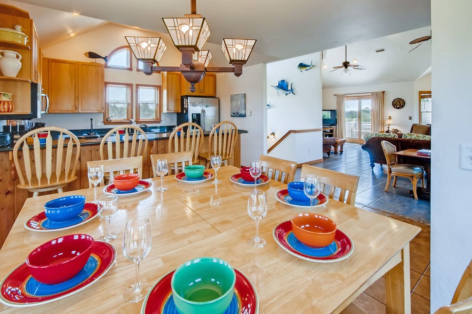 There's additional seating for 4 at the adjacent breakfast bar so everyone can dine together.