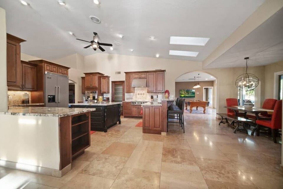 Your spacious gourmet kitchen flows seamlessly into the dining area, perfect for creating memorable meals and gathering with loved ones.