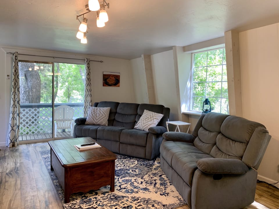 Cozy living room with reclining couch and love seat