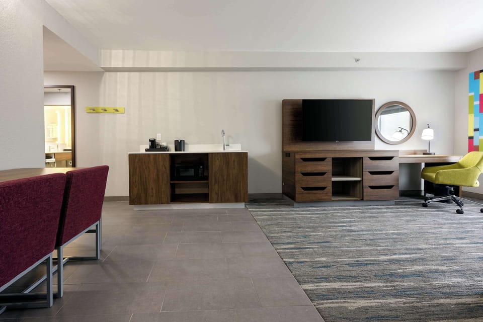 Suite, 1 King Bed, Non Smoking | In-room safe, blackout drapes, iron/ironing board, cribs/infant beds