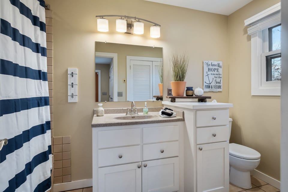Main floor spacious bathroom with full jacuzzi tub and shower. 