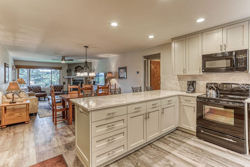 The updated kitchen looks out on the great room.