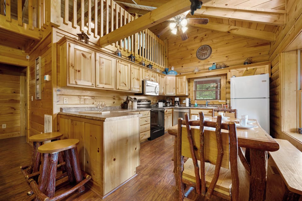 Fully stocked kitchen with 6 seat dining table and  2 bar stools
