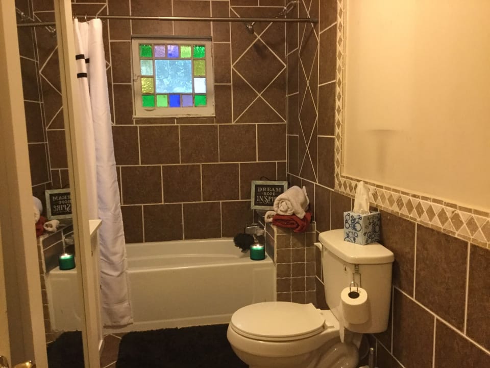 Spacious bathroom perfect for soaking and relaxing. 