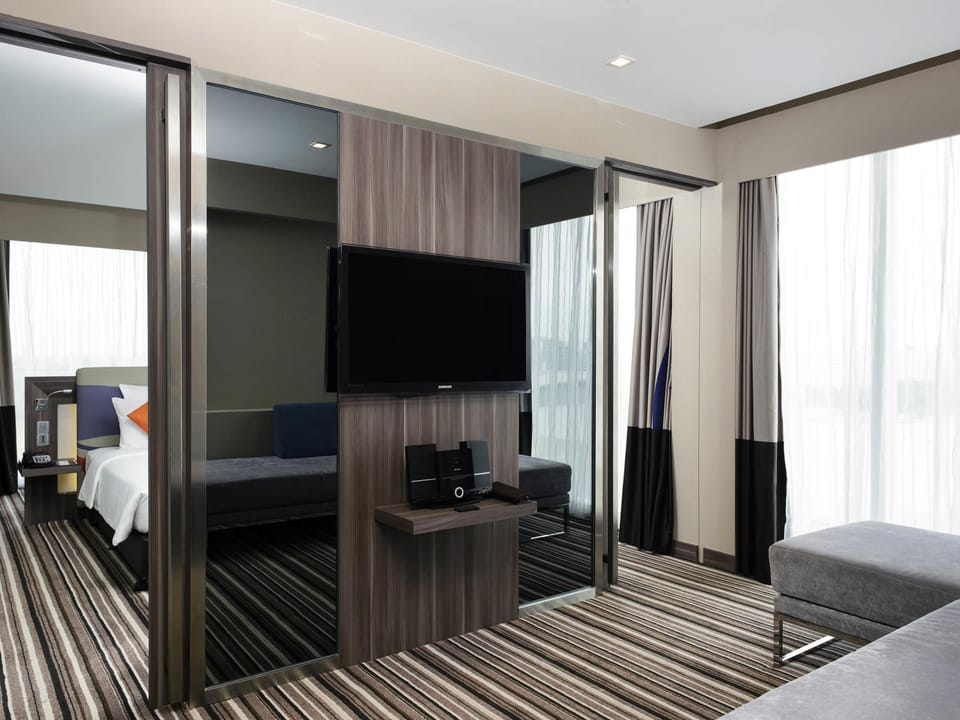 Premier Suite, 1 King Bed | Minibar, in-room safe, individually decorated, individually furnished