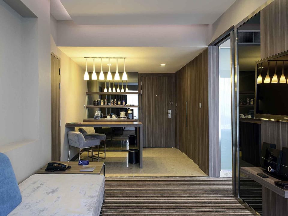Premier Suite, 1 King Bed | Minibar, in-room safe, individually decorated, individually furnished