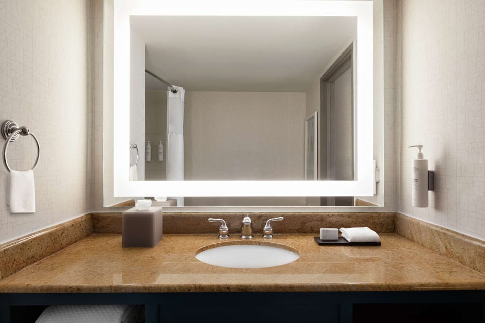 Combined shower/tub, designer toiletries, hair dryer, towels