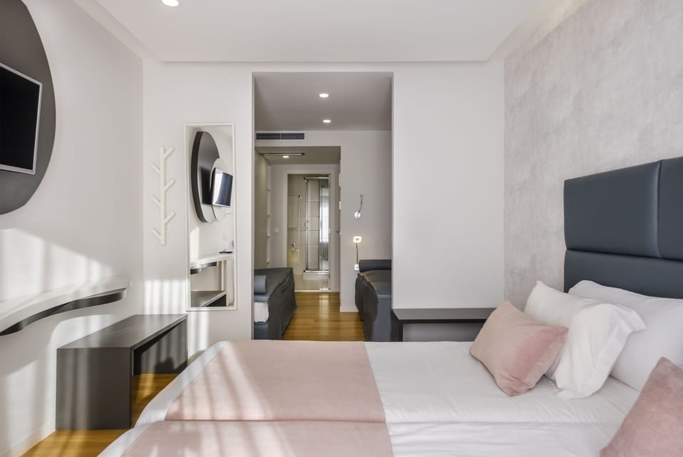 Hypo-allergenic bedding, blackout drapes, iron/ironing board, free WiFi