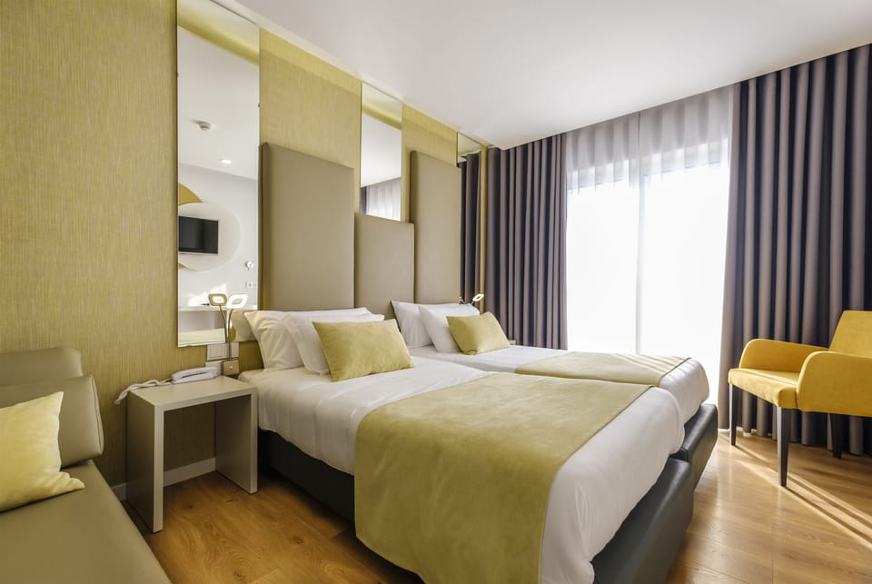 Hypo-allergenic bedding, blackout drapes, iron/ironing board, free WiFi
