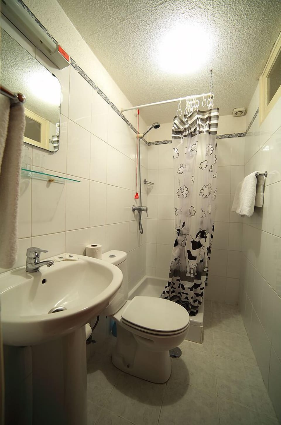 Shower, rainfall showerhead, hair dryer, towels