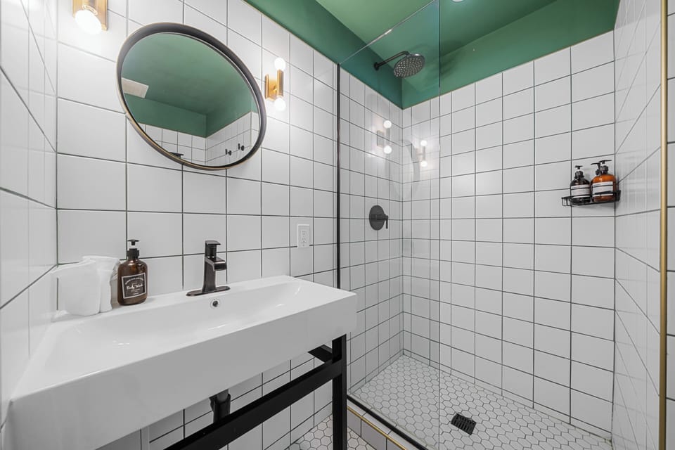 Superior King w/ Kitchenette | Bathroom | Shower, designer toiletries, hair dryer, towels