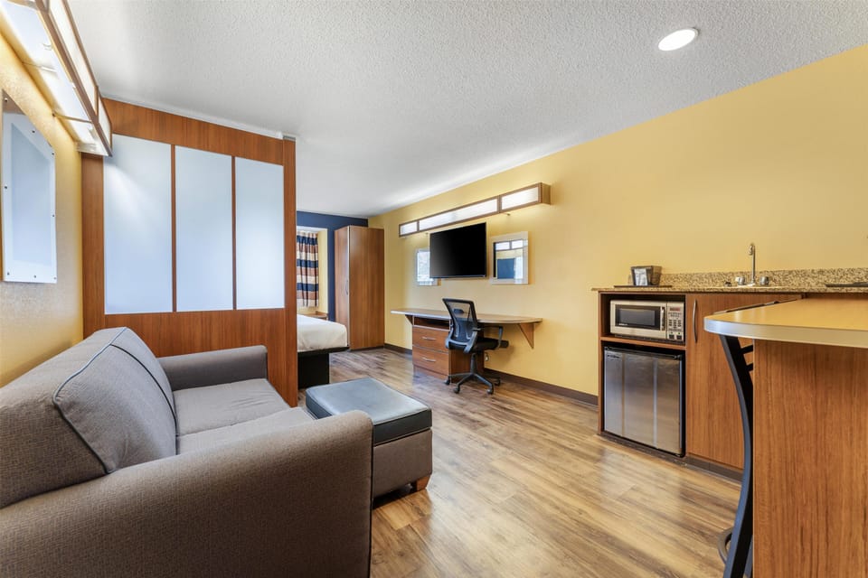 Suite, 1 King Bed, Non Smoking, Refrigerator & Microwave (with Single Sofabed;Larger Room) | Hypo-allergenic bedding, pillowtop beds, desk, laptop workspace