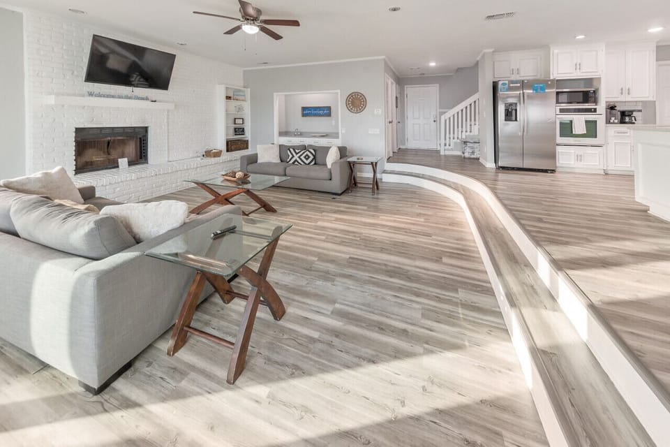 Spacious open-concept living area with modern coastal décor.