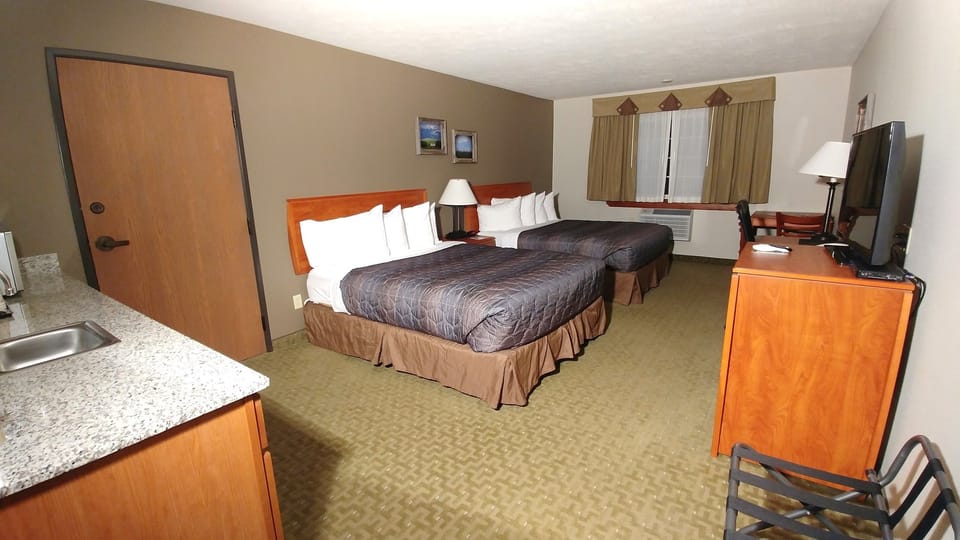 Executive Two Queens | Blackout drapes, iron/ironing board, cribs (free), bed sheets