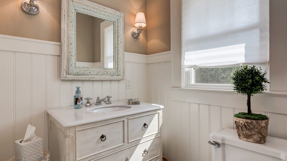 First floor bathroom offers vanity, toilet and shower