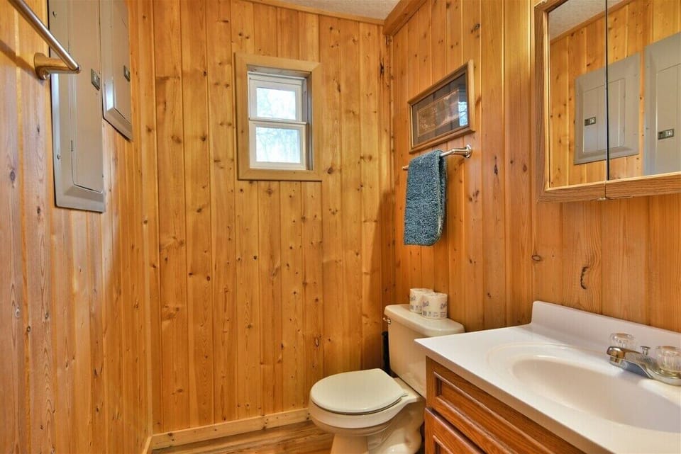 The second bathroom in the cabin has a shower.