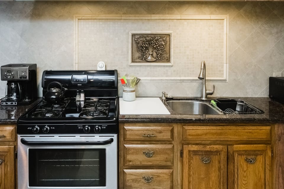Fully equipped kitchen with gas range, toaster oven, microwave and more.
