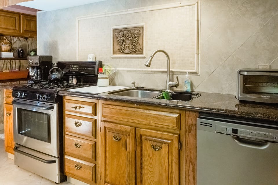 Fully equipped kitchen with gas range, toaster oven, microwave and more.