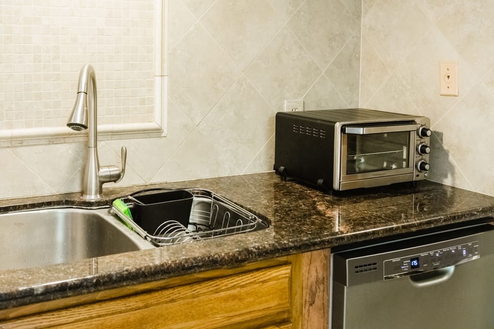 Fully equipped kitchen with gas range, toaster oven, microwave and more.