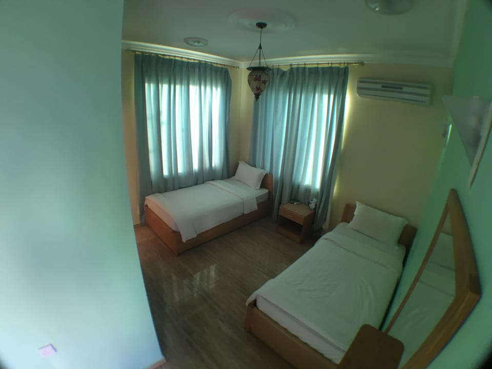Single Room, Private Bathroom | Minibar, WiFi (free), bed sheets